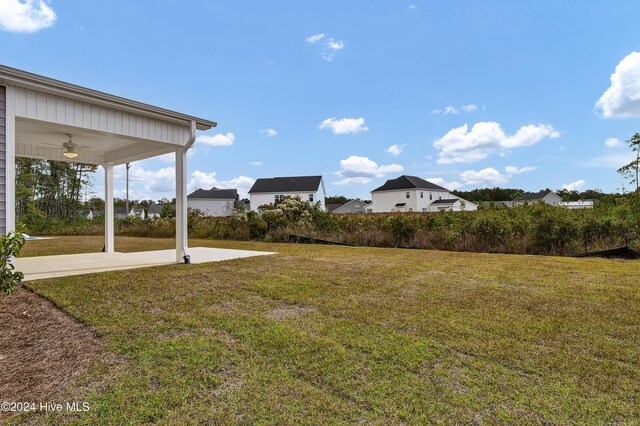 2765 Longleaf Pine Cir, Leland, NC 28451 - view of green lawn with a ceiling fan