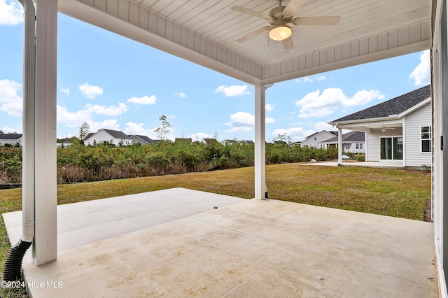 view of patio featuring ceiling fan