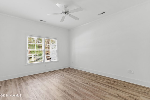 unfurnished room featuring ceiling fan, ornamental molding, and light hardwood / wood-style flooring