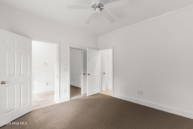 1017 Headwater Cove Ln, Wilmington, NC 28403 - unfurnished bedroom featuring carpet, crown molding, tile patterned flooring, a closet, and baseboards