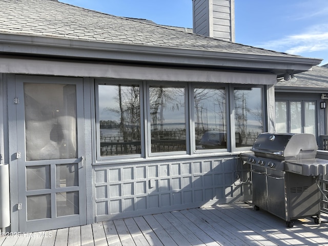 wooden terrace featuring grilling area