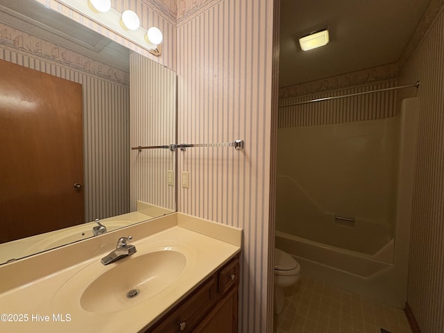 full bathroom featuring tile patterned floors, vanity, toilet, and shower / bathing tub combination