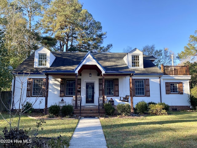 1121 Vance St N, Wilson, NC 27893 - cape cod home featuring a front yard and covered porch