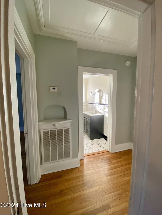 1121 Vance St N, Wilson, NC 27893 - hall with light wood-style flooring and attic access