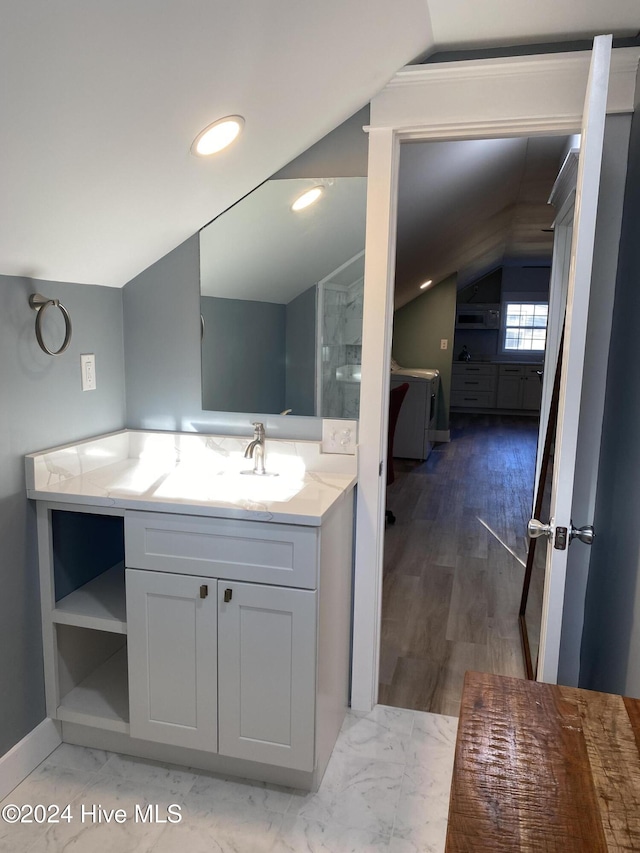 1121 Vance St N, Wilson, NC 27893 - bathroom with lofted ceiling, vanity, recessed lighting, and marble finish flooring