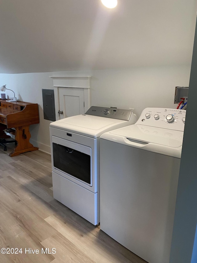 1121 Vance St N, Wilson, NC 27893 - washroom featuring electric panel, independent washer and dryer, and light wood finished floors