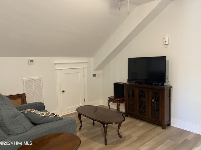 1121 Vance St N, Wilson, NC 27893 - living area featuring light wood-type flooring and lofted ceiling