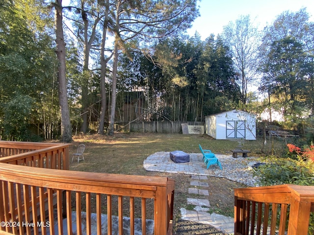 1121 Vance St N, Wilson, NC 27893 - view of yard featuring an outdoor fire pit, a storage shed, and a patio