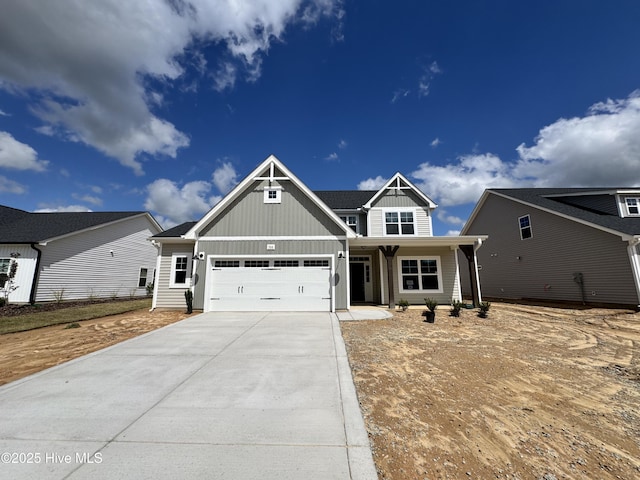 craftsman house featuring driveway, an attached garage, and board and batten siding