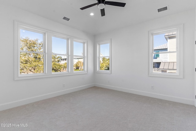 carpeted empty room with ceiling fan