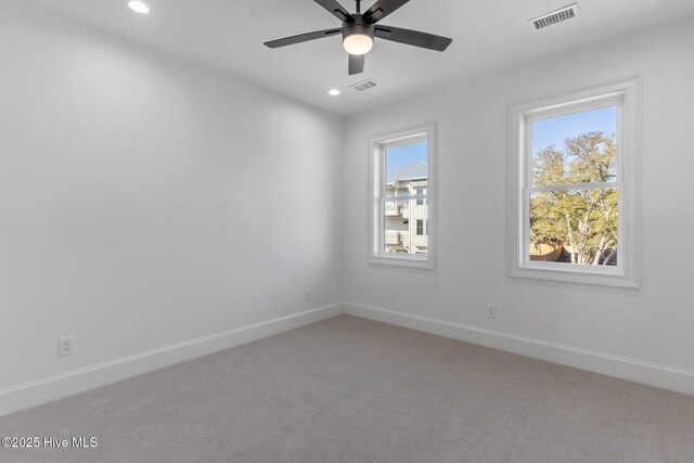 unfurnished bedroom featuring ceiling fan, a closet, and light carpet