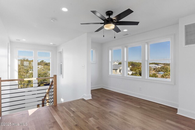 doorway with light hardwood / wood-style flooring, french doors, and a water view