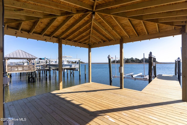 dock area with a gazebo and a water view