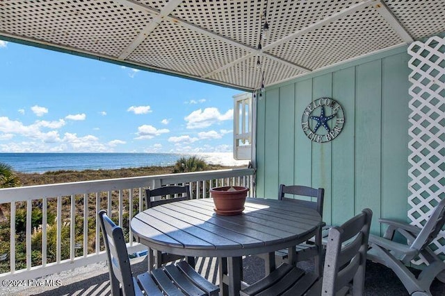 wooden deck with a water view