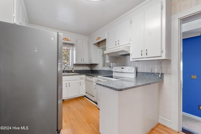 kitchen with white cabinetry and white appliances