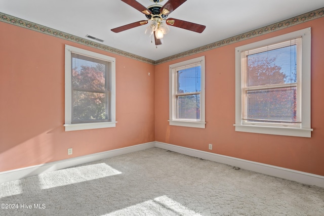 carpeted empty room with ceiling fan