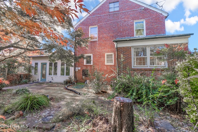 back of property featuring a patio area