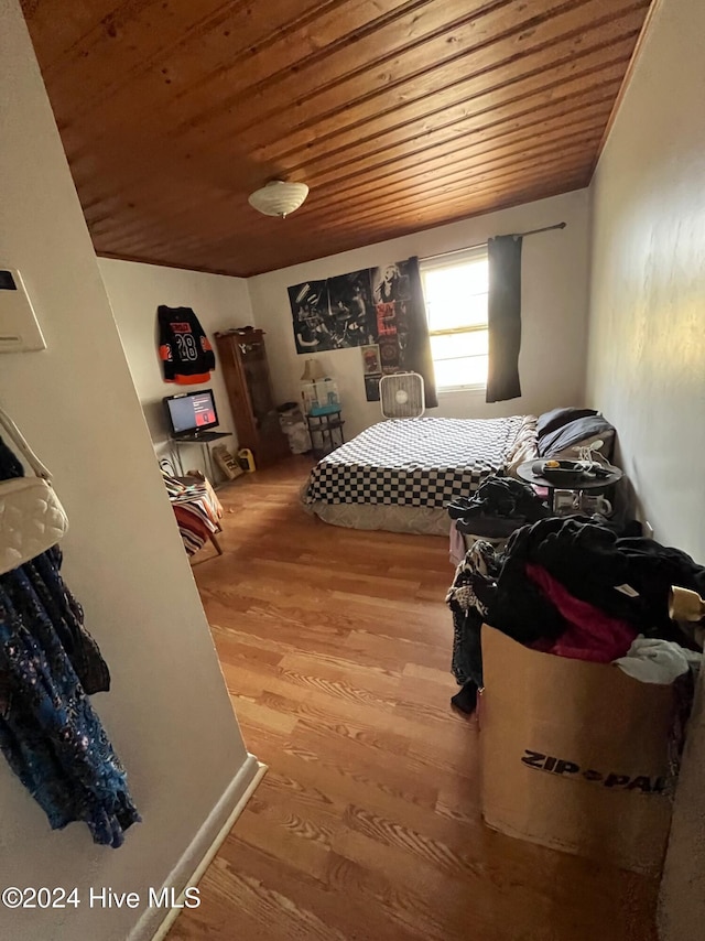 bedroom with wood-type flooring and wood ceiling