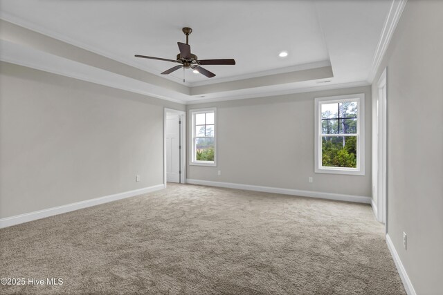 2786 Longleaf Pine Cir, Leland, NC 28451 - unfurnished bedroom with carpet, a raised ceiling, crown molding, recessed lighting, and multiple windows