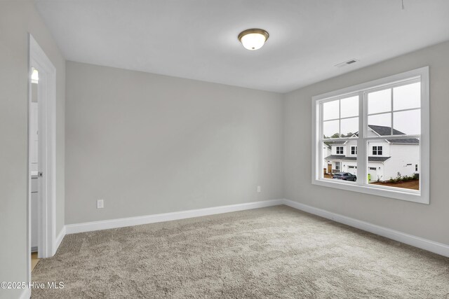 2786 Longleaf Pine Cir, Leland, NC 28451 - unfurnished bedroom featuring attic access, carpet flooring, and a closet