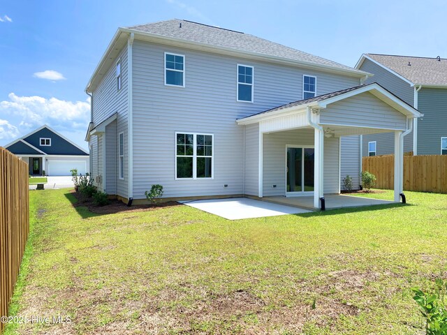 2786 Longleaf Pine Cir, Leland, NC 28451 - rear view of property featuring ceiling fan, a patio, and a lawn