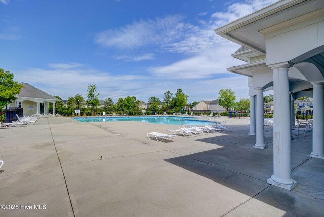 2786 Longleaf Pine Cir, Leland, NC 28451 - community pool featuring a patio