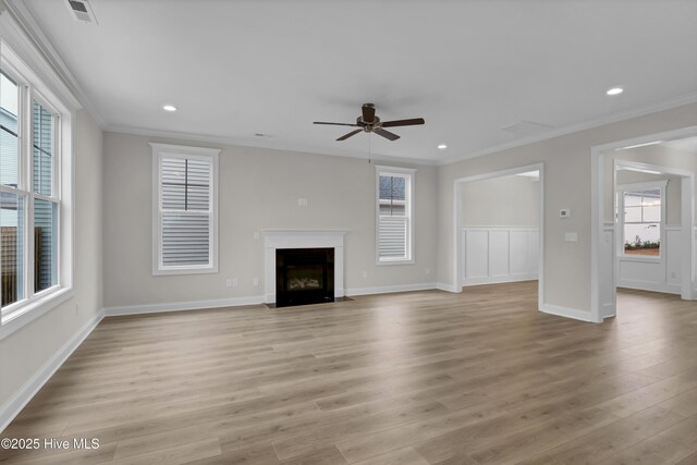 2786 Longleaf Pine Cir, Leland, NC 28451 - kitchen featuring appliances with stainless steel finishes, decorative backsplash, light countertops, a center island with sink, and recessed lighting