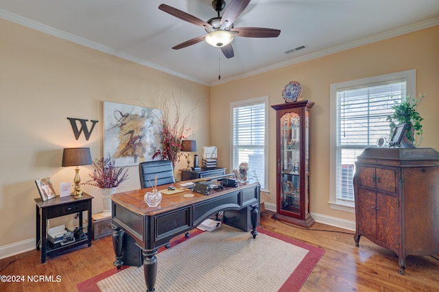 office space featuring ceiling fan, wood-type flooring, and crown molding