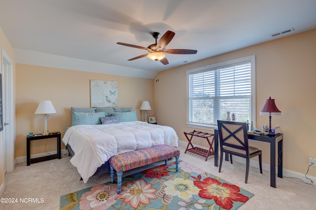 bedroom featuring ceiling fan and light colored carpet