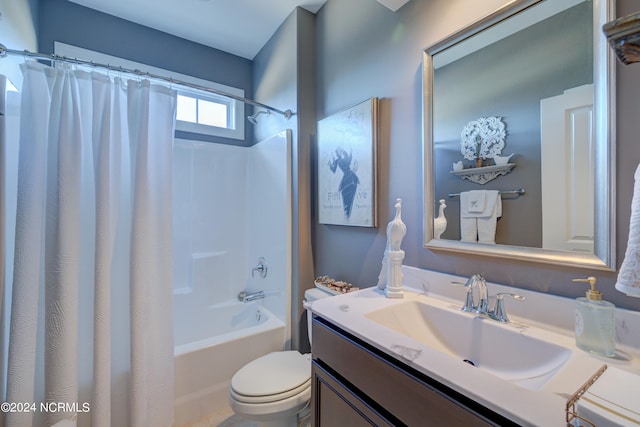 full bathroom with shower / tub combo, vanity, and toilet