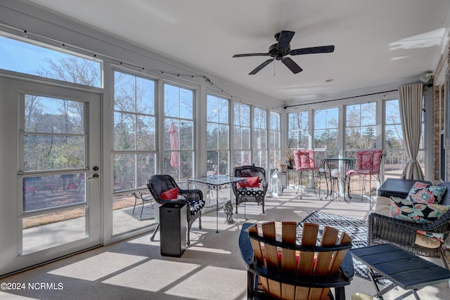 sunroom / solarium with ceiling fan