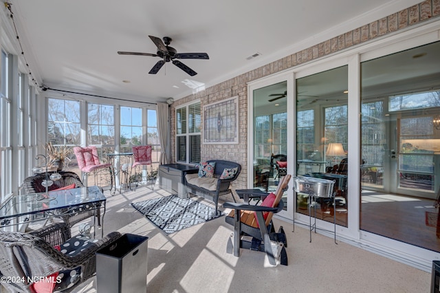 sunroom / solarium with ceiling fan