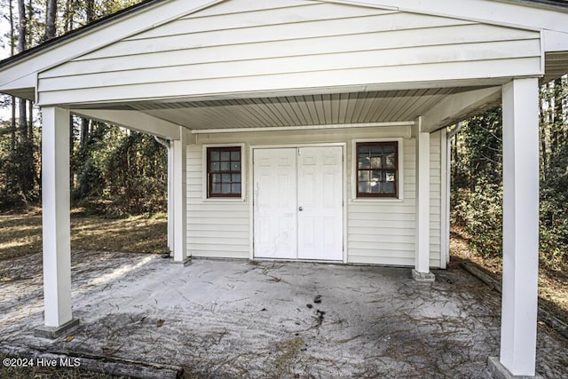 view of outdoor structure with a carport