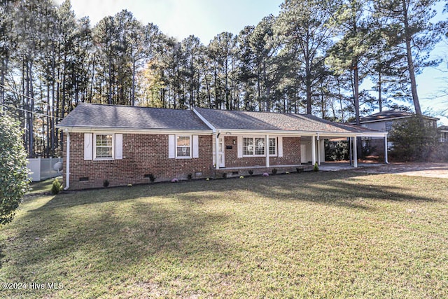 ranch-style house with a front lawn and a carport