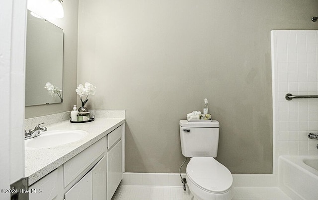 bathroom with vanity, tile patterned floors, and toilet