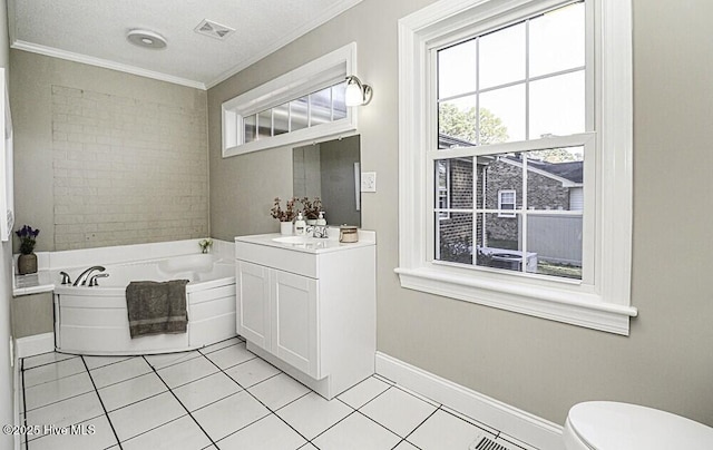 bathroom featuring toilet, crown molding, vanity, a tub, and tile patterned flooring