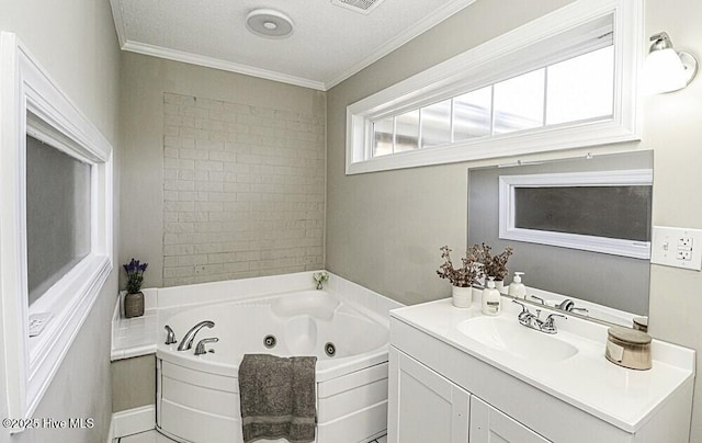 bathroom with tile patterned floors, a tub to relax in, a textured ceiling, ornamental molding, and vanity