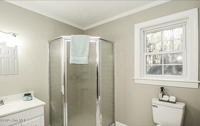 bathroom featuring vanity, ornamental molding, an enclosed shower, and toilet