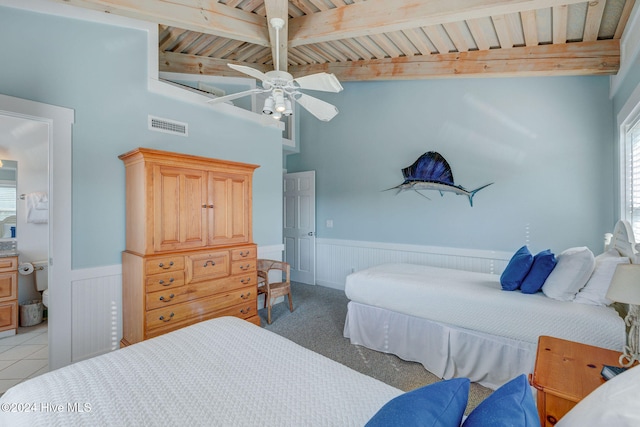 carpeted bedroom with beam ceiling, ceiling fan, and wood ceiling