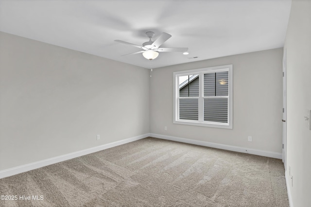 carpeted empty room with ceiling fan