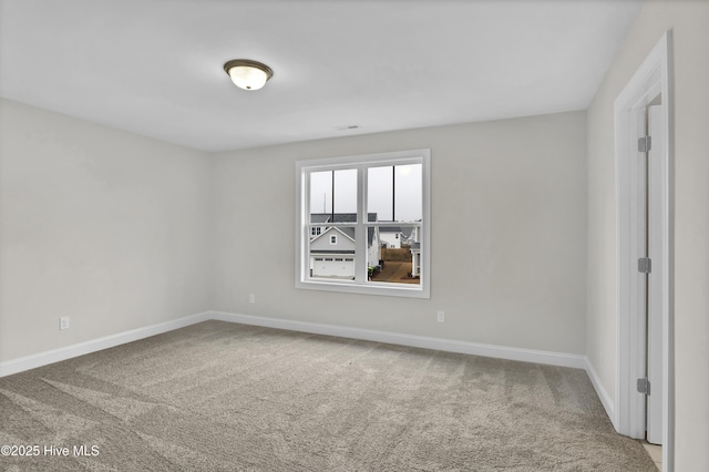 view of carpeted spare room