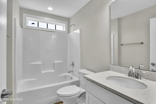 full bathroom with vanity, toilet, and  shower combination