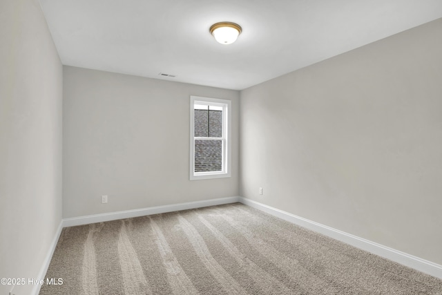 empty room featuring carpet flooring