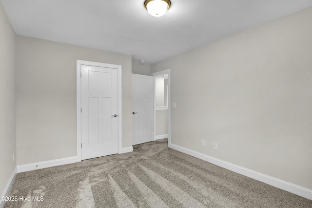 unfurnished bedroom with carpet and a closet