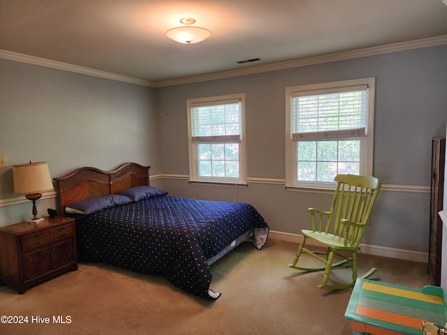 bedroom with carpet flooring, multiple windows, and ornamental molding