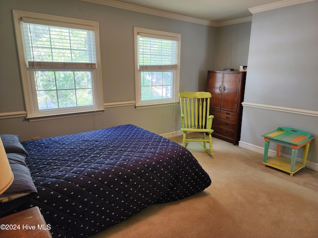 carpeted bedroom featuring multiple windows and ornamental molding