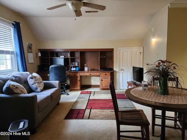 living room featuring light carpet, vaulted ceiling, and ceiling fan