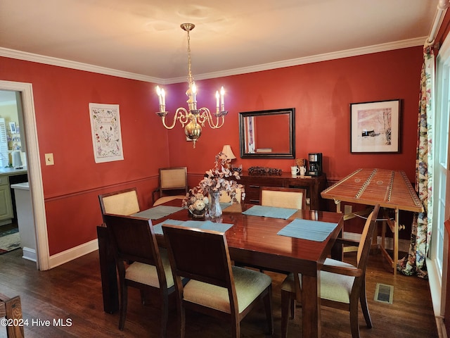 dining room with ornamental molding, dark wood-type flooring, and a notable chandelier