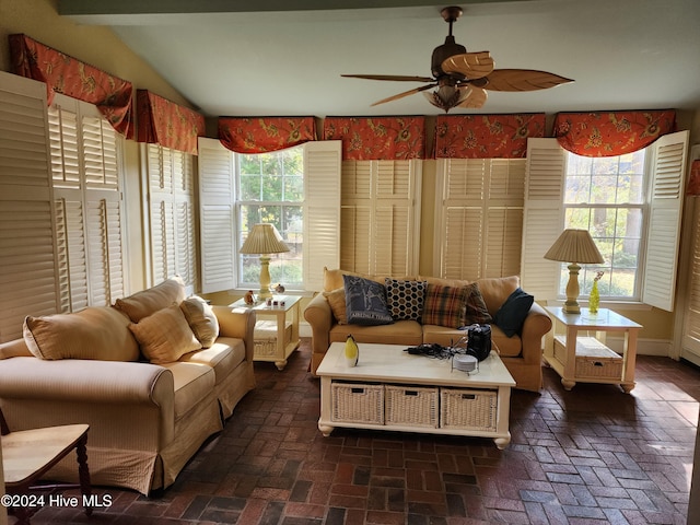 living room with ceiling fan and plenty of natural light