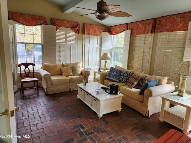 living room featuring a wealth of natural light and ceiling fan